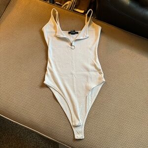 white zip up body suit
